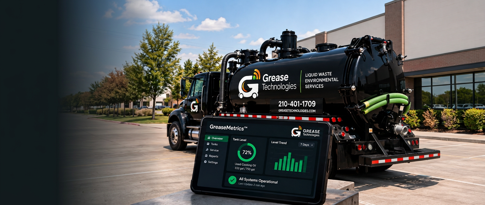 Black Grease Technologies vacuum truck with the GreaseMetrics monitoring tablet in the foreground